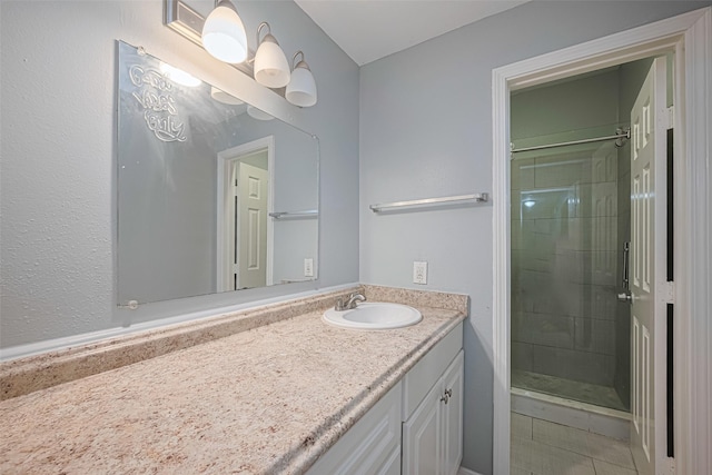 bathroom featuring vanity and a stall shower