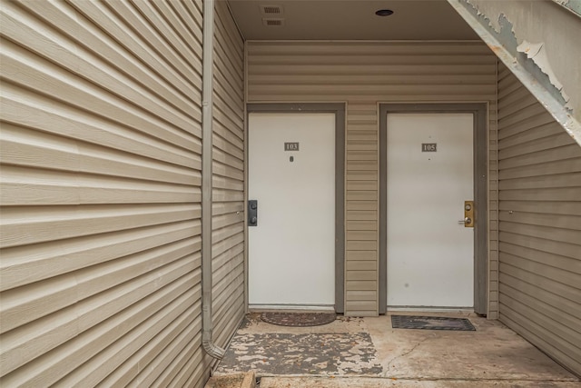 view of exterior entry featuring visible vents