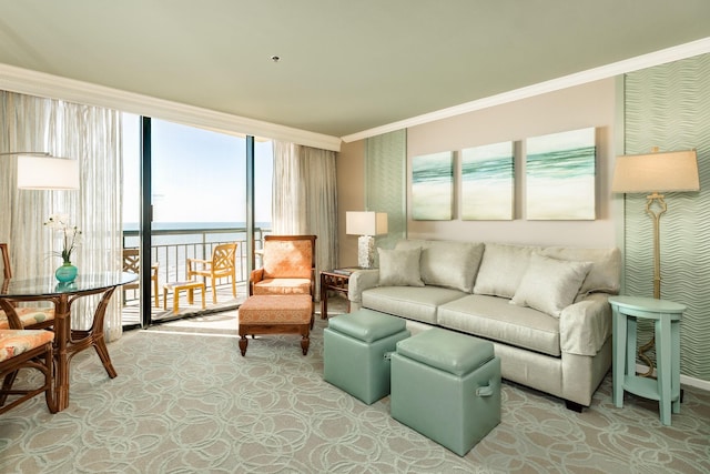living room with a water view, wallpapered walls, ornamental molding, and light carpet