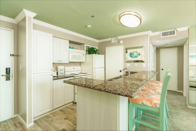 kitchen featuring visible vents, crown molding, open shelves, a sink, and white appliances