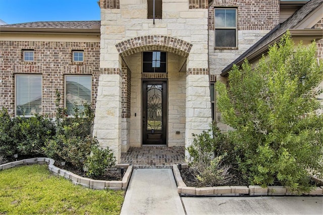 view of exterior entry with stone siding