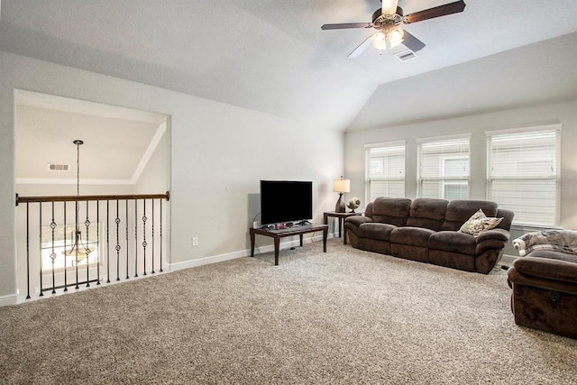 living room featuring carpet flooring, a ceiling fan, visible vents, and vaulted ceiling