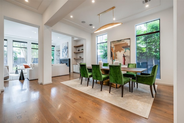 dining space with visible vents, recessed lighting, and wood finished floors