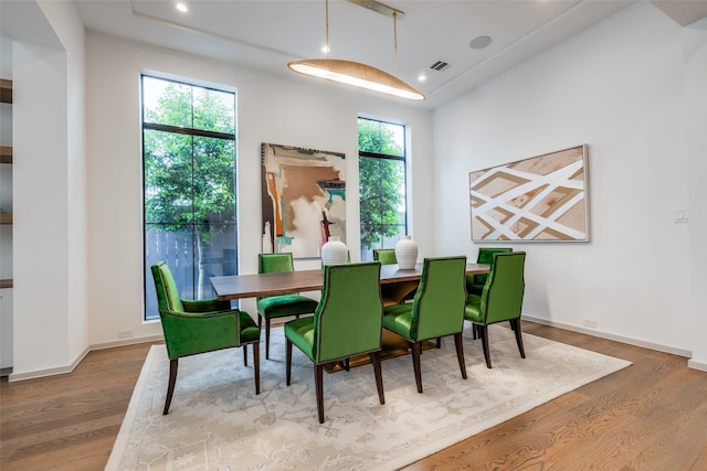dining area featuring baseboards, recessed lighting, wood finished floors, and visible vents