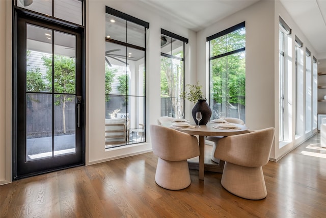 dining room featuring recessed lighting, baseboards, and wood finished floors
