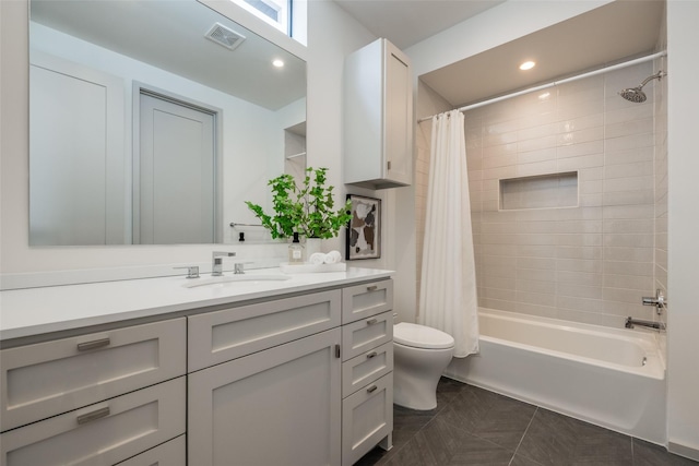 full bathroom featuring visible vents, tile patterned flooring, vanity, toilet, and shower / bathtub combination with curtain