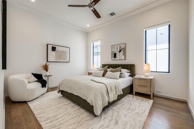 bedroom featuring recessed lighting, baseboards, visible vents, and wood finished floors