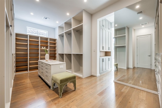 spacious closet featuring visible vents and light wood-style flooring
