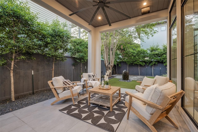 view of patio / terrace featuring outdoor lounge area, a ceiling fan, and a fenced backyard
