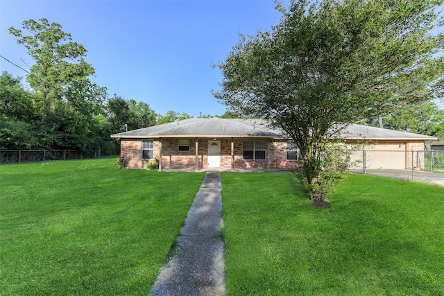 ranch-style house with an attached garage, a front lawn, fence, and concrete driveway