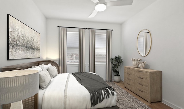 bedroom with baseboards, ceiling fan, and light wood-type flooring