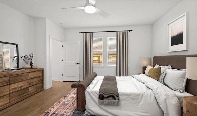 bedroom featuring a ceiling fan and wood finished floors