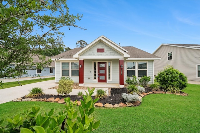 222 N Lynx Trl, Montgomery, TX 77316 - bungalow with covered porch, roof with shingles, driveway, and a front yard