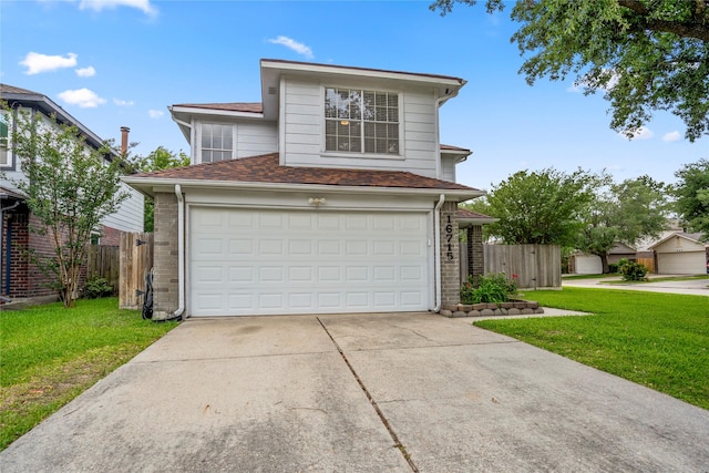 traditional-style house featuring concrete driveway, a garage, fence, and a front lawn