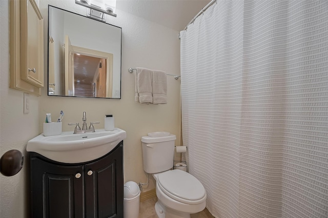 full bath featuring toilet and vanity