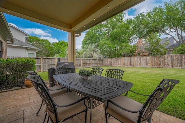 view of patio / terrace featuring a fenced backyard and outdoor dining space