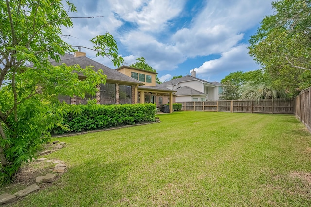 view of yard with a fenced backyard