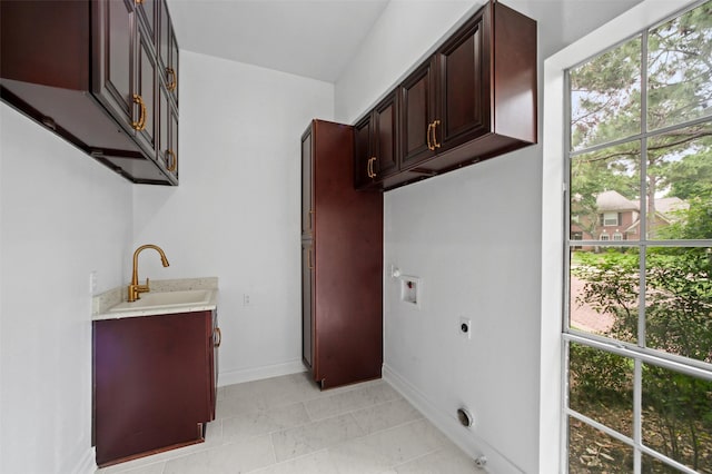 803 Mahogany Run Dr, Katy, TX 77494 - washroom featuring hookup for an electric dryer, plenty of natural light, hookup for a washing machine, and cabinet space