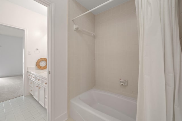 803 Mahogany Run Dr, Katy, TX 77494 - bathroom featuring shower / tub combo with curtain, tile patterned floors, vanity, and baseboards