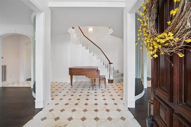803 Mahogany Run Dr, Katy, TX 77494 - foyer featuring arched walkways, stairs, tile patterned floors, and baseboards