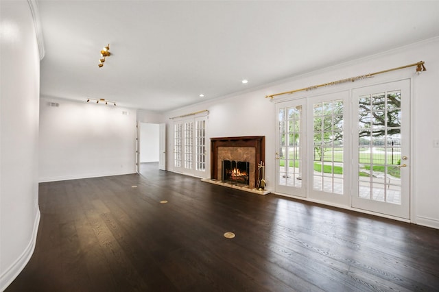 803 Mahogany Run Dr, Katy, TX 77494 - unfurnished living room featuring crown molding, dark wood-style floors, a premium fireplace, baseboards, and recessed lighting