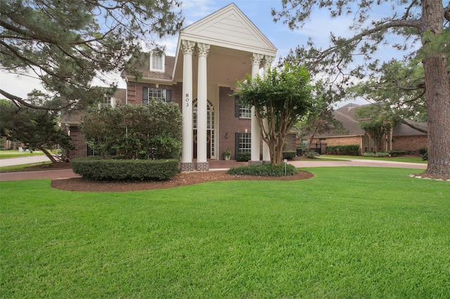 803 Mahogany Run Dr, Katy, TX 77494 - greek revival house with brick siding and a front yard
