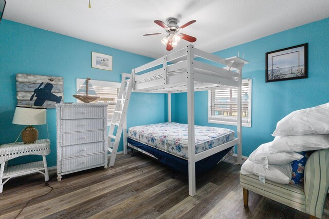 13114 Coronado Dr, Freeport, TX 77541 - bedroom with baseboards, ceiling fan, and wood finished floors