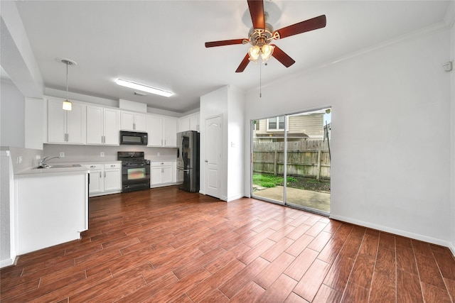 13003 Brutus Hill Ln, Houston, TX 77072 - kitchen with a ceiling fan, dark wood-type flooring, light countertops, a sink, and black appliances