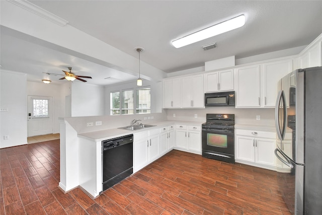 13003 Brutus Hill Ln, Houston, TX 77072 - kitchen with white cabinets, light countertops, a peninsula, visible vents, and black appliances