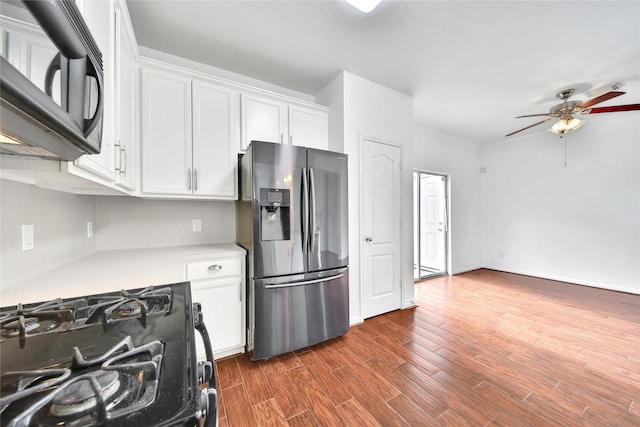 13003 Brutus Hill Ln, Houston, TX 77072 - kitchen featuring white cabinets, ceiling fan, light countertops, dark wood finished floors, and black appliances