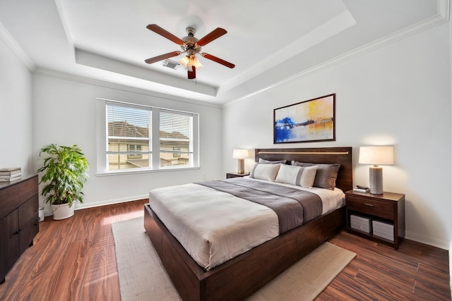 13003 Brutus Hill Ln, Houston, TX 77072 - bedroom featuring baseboards, a tray ceiling, dark wood-style flooring, and visible vents