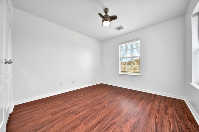 13003 Brutus Hill Ln, Houston, TX 77072 - spare room featuring baseboards, a ceiling fan, dark wood finished floors, and visible vents