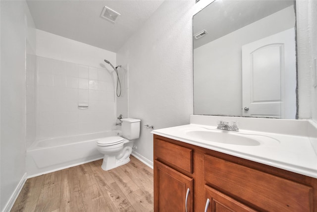 13003 Brutus Hill Ln, Houston, TX 77072 - full bathroom featuring vanity, toilet, shower / washtub combination, wood finished floors, and visible vents