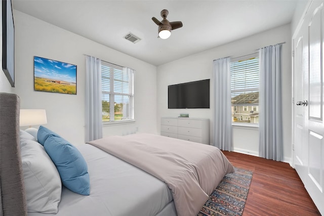 13003 Brutus Hill Ln, Houston, TX 77072 - bedroom with a ceiling fan, visible vents, multiple windows, and wood finished floors