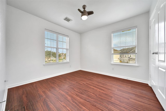 13003 Brutus Hill Ln, Houston, TX 77072 - spare room featuring visible vents, plenty of natural light, dark wood-type flooring, and ceiling fan
