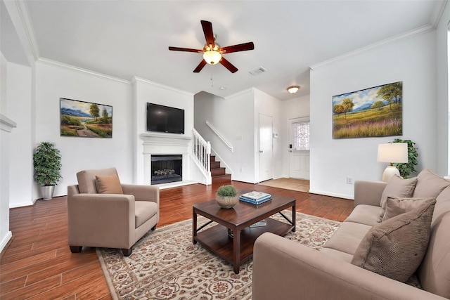 13003 Brutus Hill Ln, Houston, TX 77072 - living area featuring ceiling fan, crown molding, wood finished floors, baseboards, and a fireplace with raised hearth