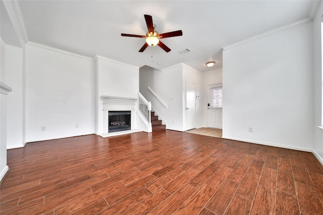 13003 Brutus Hill Ln, Houston, TX 77072 - unfurnished living room with a ceiling fan, visible vents, crown molding, wood finished floors, and a fireplace with raised hearth