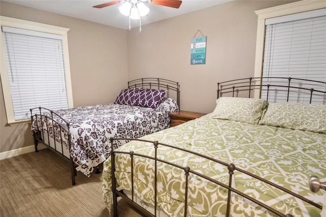 bedroom with baseboards and a ceiling fan