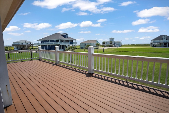 wooden deck featuring a yard