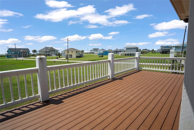 deck featuring a yard and a residential view