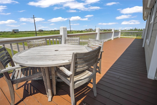 wooden terrace with outdoor dining space
