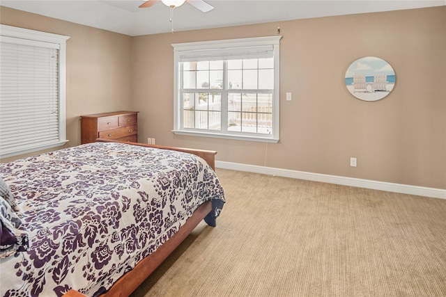 bedroom featuring carpet floors, baseboards, and ceiling fan