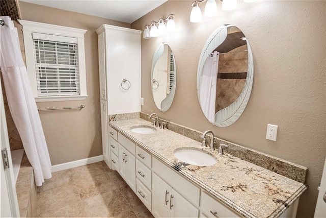 full bath with a sink, a shower with curtain, and double vanity