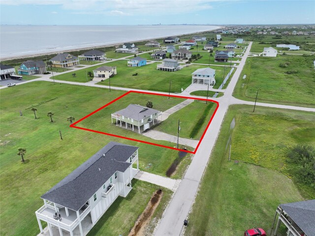 824 Rancho Caribe Dr, Port Bolivar, TX 77650 - aerial view of property and surrounding area with a nearby body of water and property parcel outlined