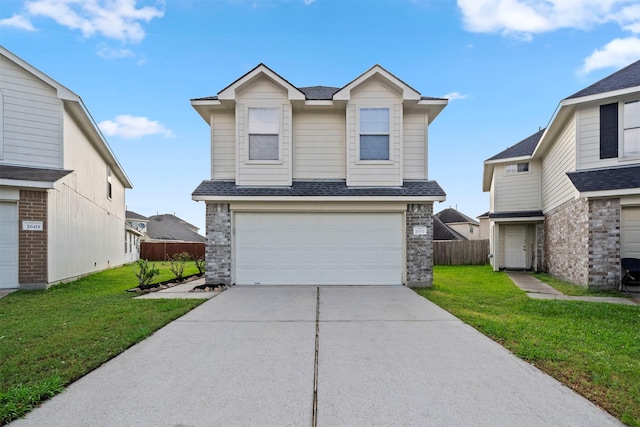 traditional-style home featuring a garage, a front lawn, roof with shingles, and concrete driveway