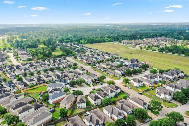bird's eye view featuring a view of trees and a residential view