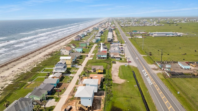 bird's eye view with a water view and a view of the beach