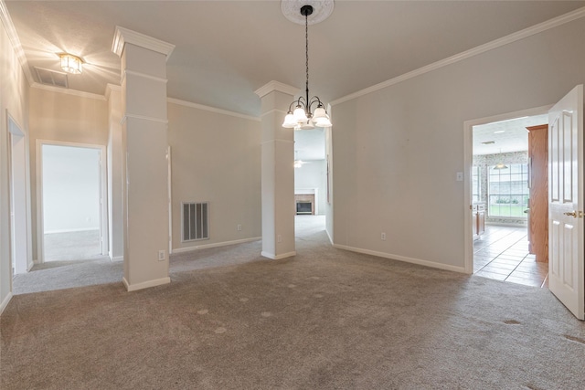 interior space featuring visible vents, ornamental molding, carpet, and a notable chandelier