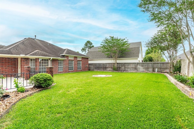 view of yard featuring a fenced backyard