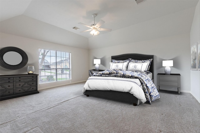 bedroom with visible vents, baseboards, carpet, and lofted ceiling